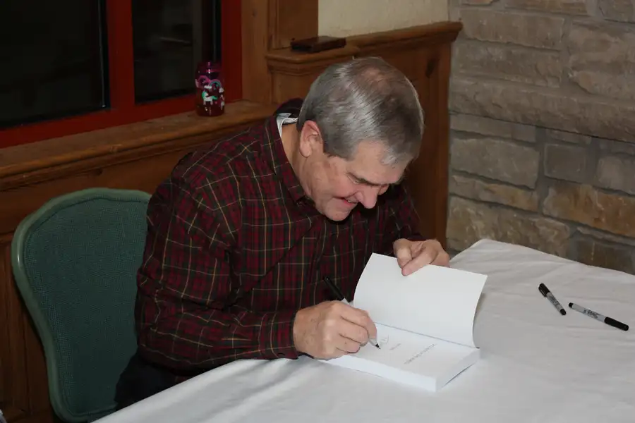 Rick Signing his Book